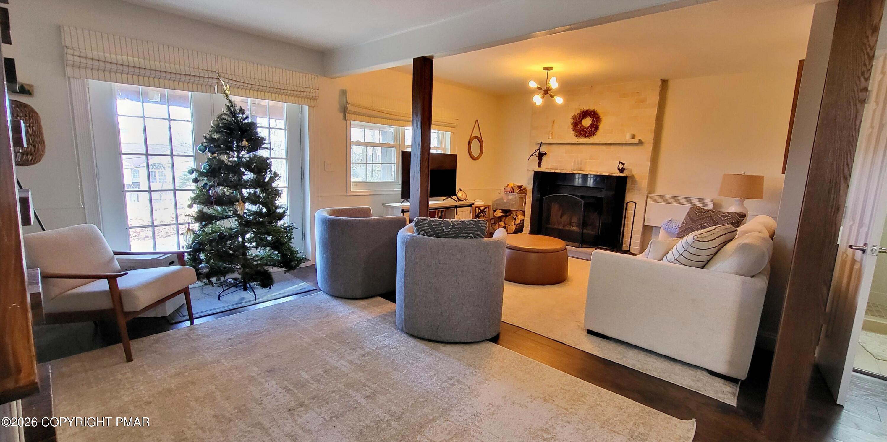 1093 Porter Drive Bushkill, PA 18324 - Photo 32 of 66 a living room with furniture and a potted plant