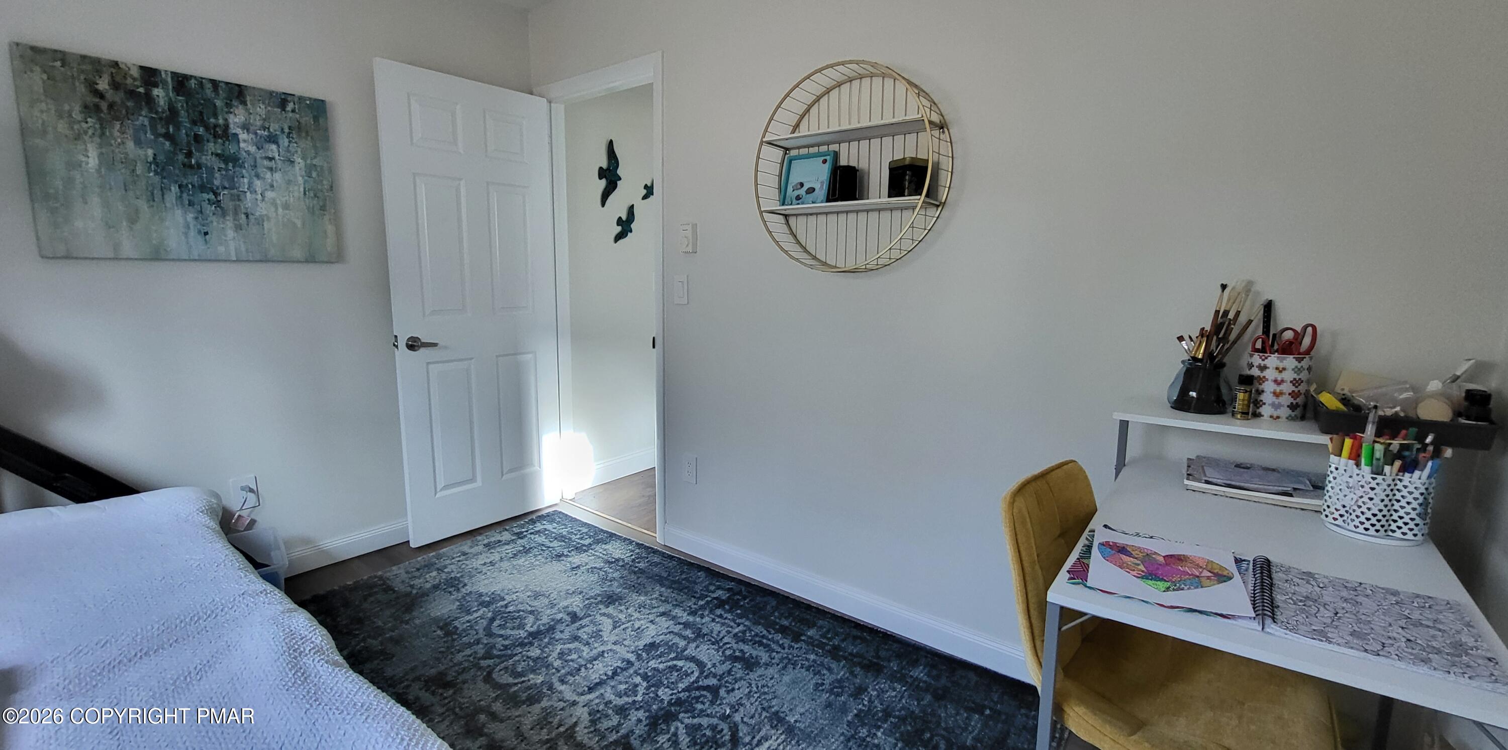 1093 Porter Drive Bushkill, PA 18324 - Photo 34 of 66 a view of room with furniture and wooden floor