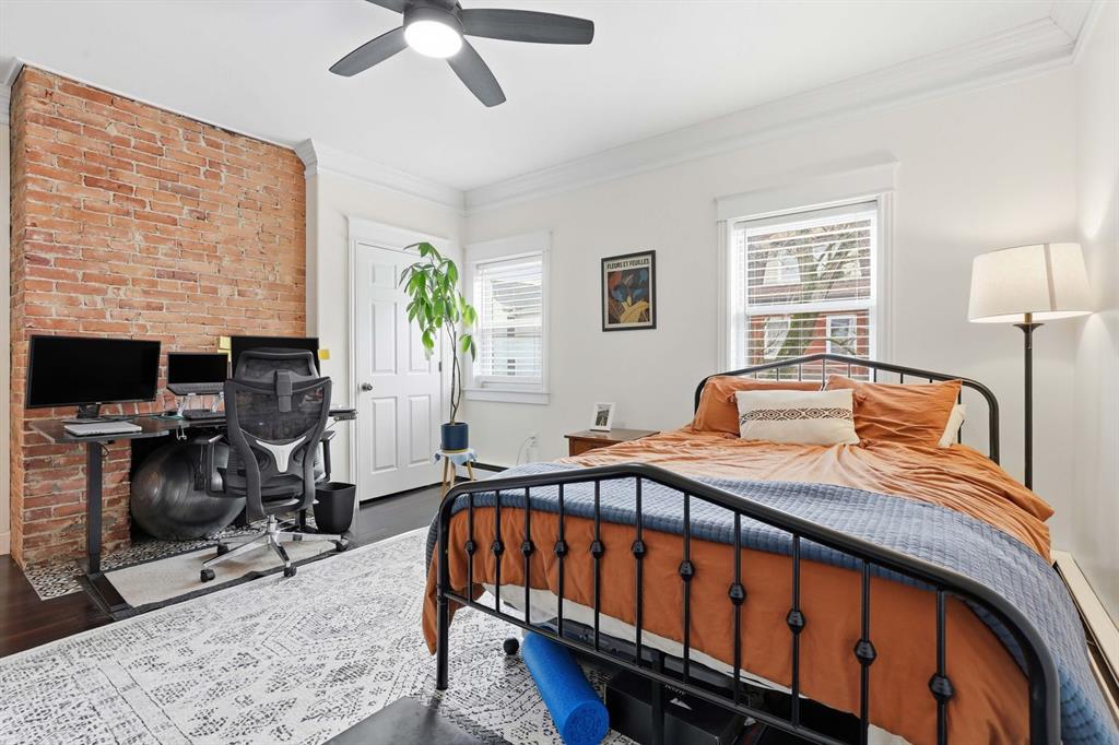5133 Holmes Street Pittsburgh, PA 15201 - Photo 25 of 45 The second bedroom is spacious and bright and has an exposed brick wall
