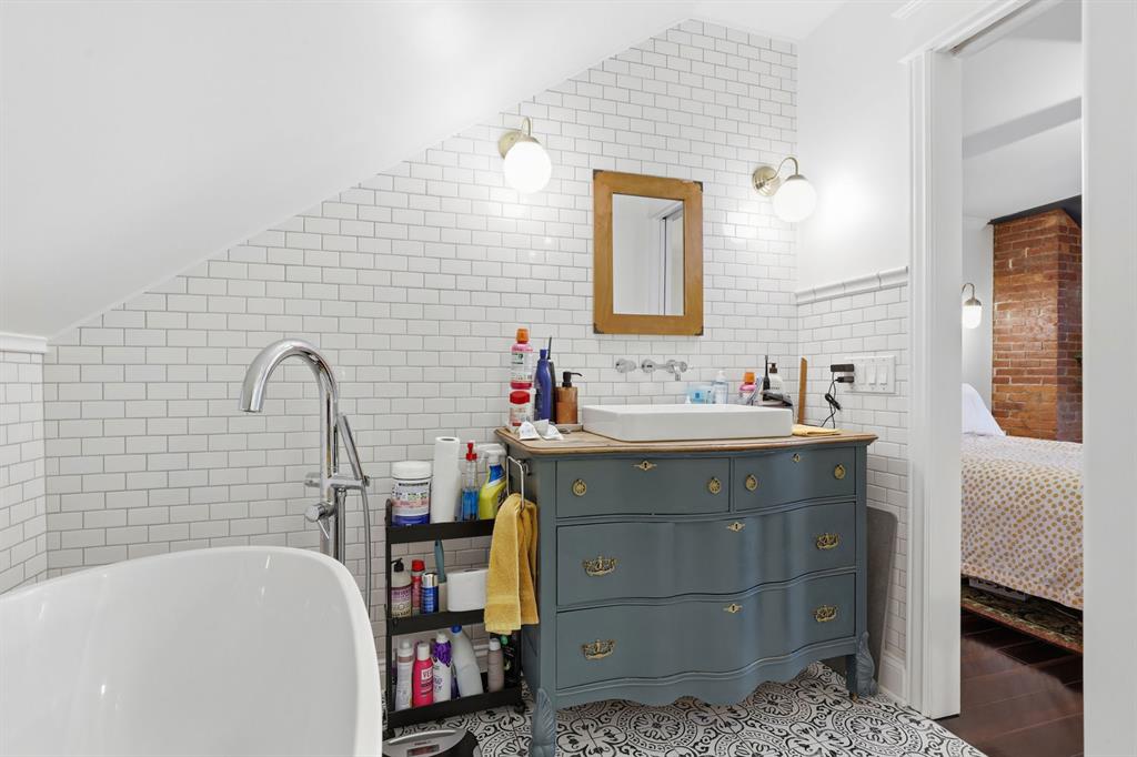 5133 Holmes Street Pittsburgh, PA 15201 - Photo 34 of 45 The primary bathroom features a walk in glass shower, soaking tub and beautiful vanity