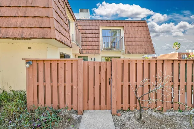a view of a wooden fence