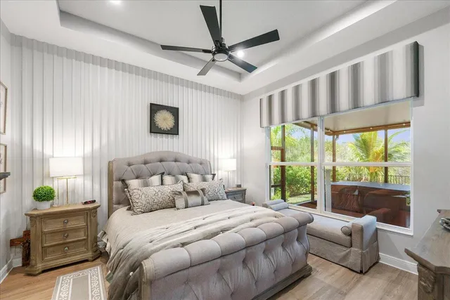 a bedroom with furniture and a flat screen tv