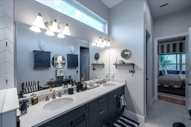 a bathroom with a double vanity sink and a mirror