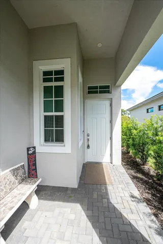 a kitchen with a sink dining table and chairs