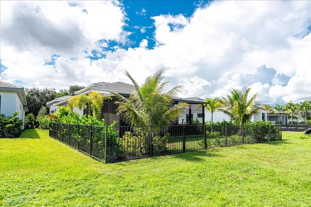 a view of a lake with houses in the back