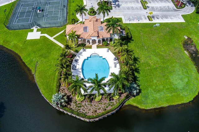 a view of a swimming pool with a yard