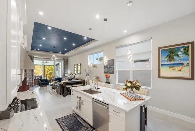 a kitchen with a refrigerator and a sink