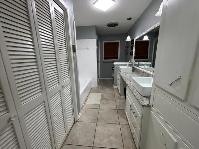 a bathroom with a sink a mirror and a toilet