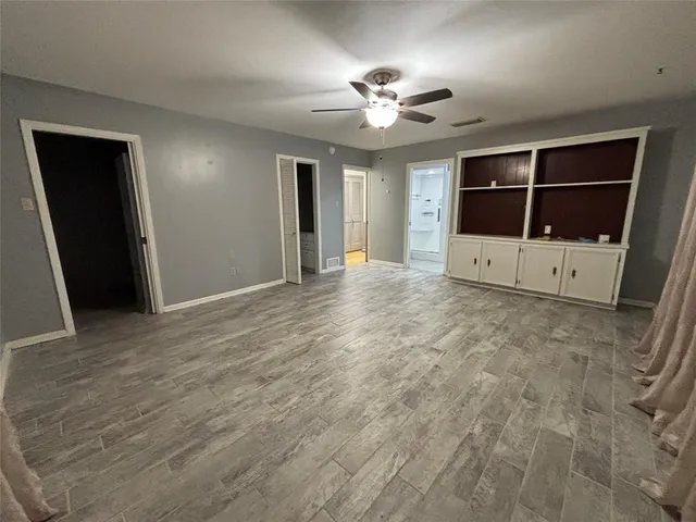 a view of an empty room with a bathroom