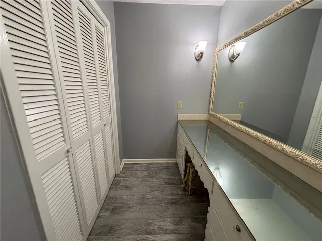 a view of a hallway with stairs