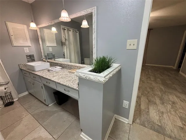 a bathroom with a sink and mirror