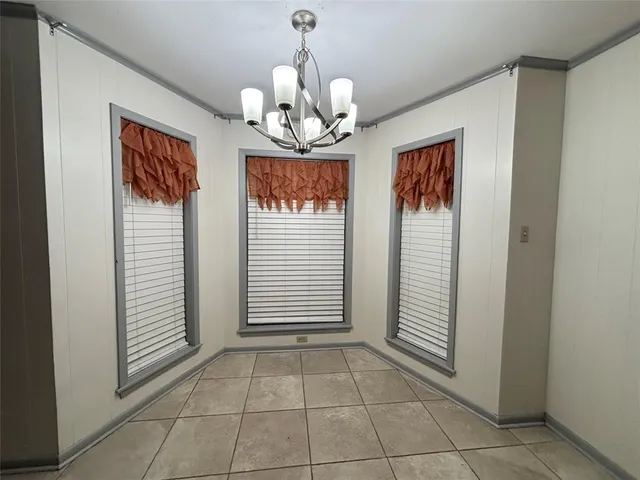 a view of an entryway with chandelier