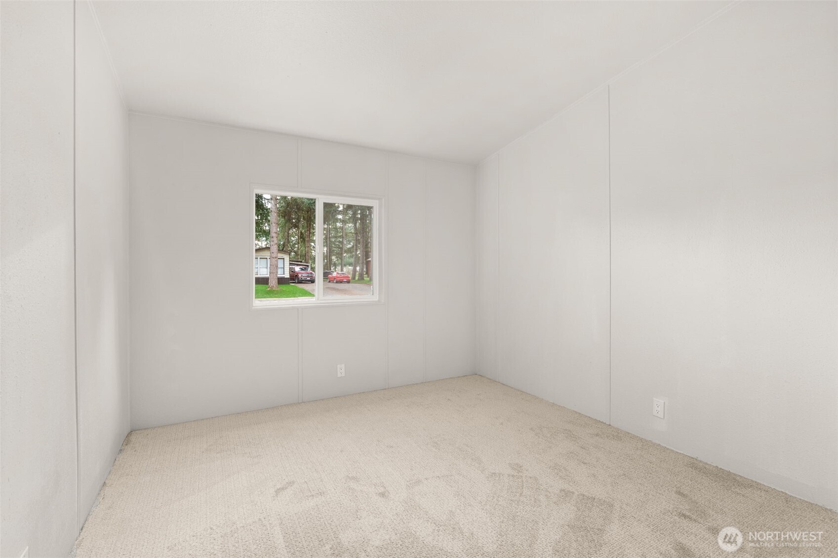 17340 Sargent Road Southwest, Unit 17 Rochester, WA 98579 - Photo 14 of 23 an empty room with a window