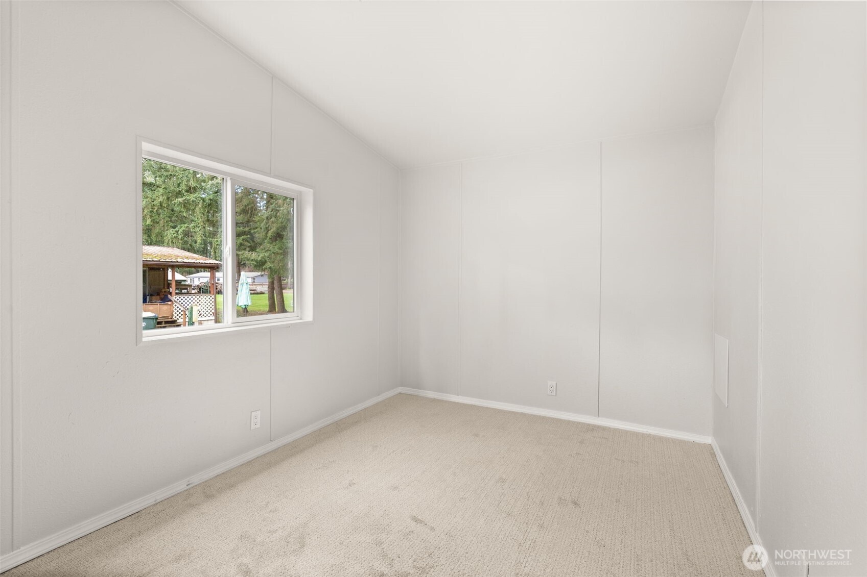 17340 Sargent Road Southwest, Unit 17 Rochester, WA 98579 - Photo 16 of 23 an empty room with a window