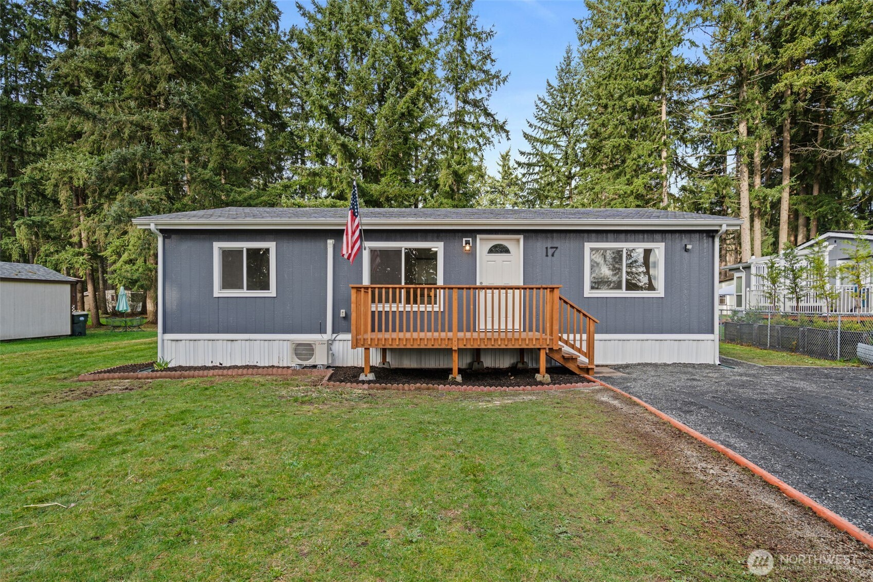 17340 Sargent Road Southwest, Unit 17 Rochester, WA 98579 - Photo 18 of 23 a view of a house with a yard and fence