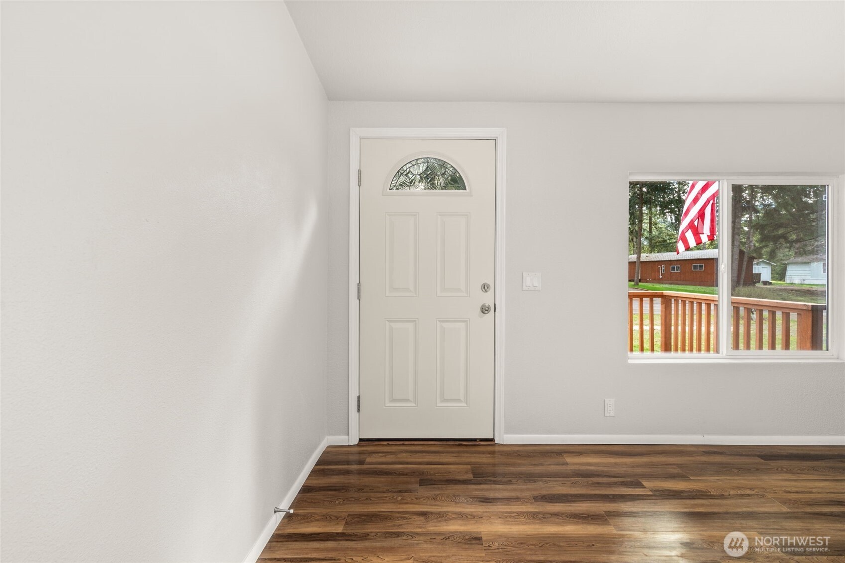 17340 Sargent Road Southwest, Unit 17 Rochester, WA 98579 - Photo 2 of 23 a view of an entryway with wooden floor