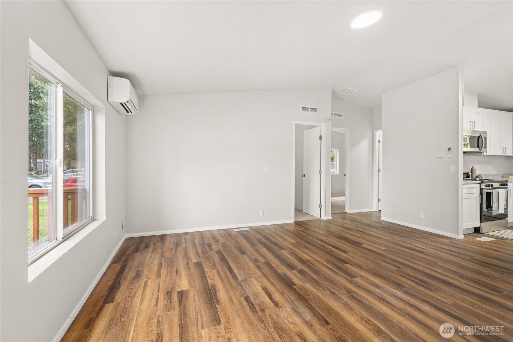 17340 Sargent Road Southwest, Unit 17 Rochester, WA 98579 - Photo 3 of 23 a view of empty room with wooden floor and fan