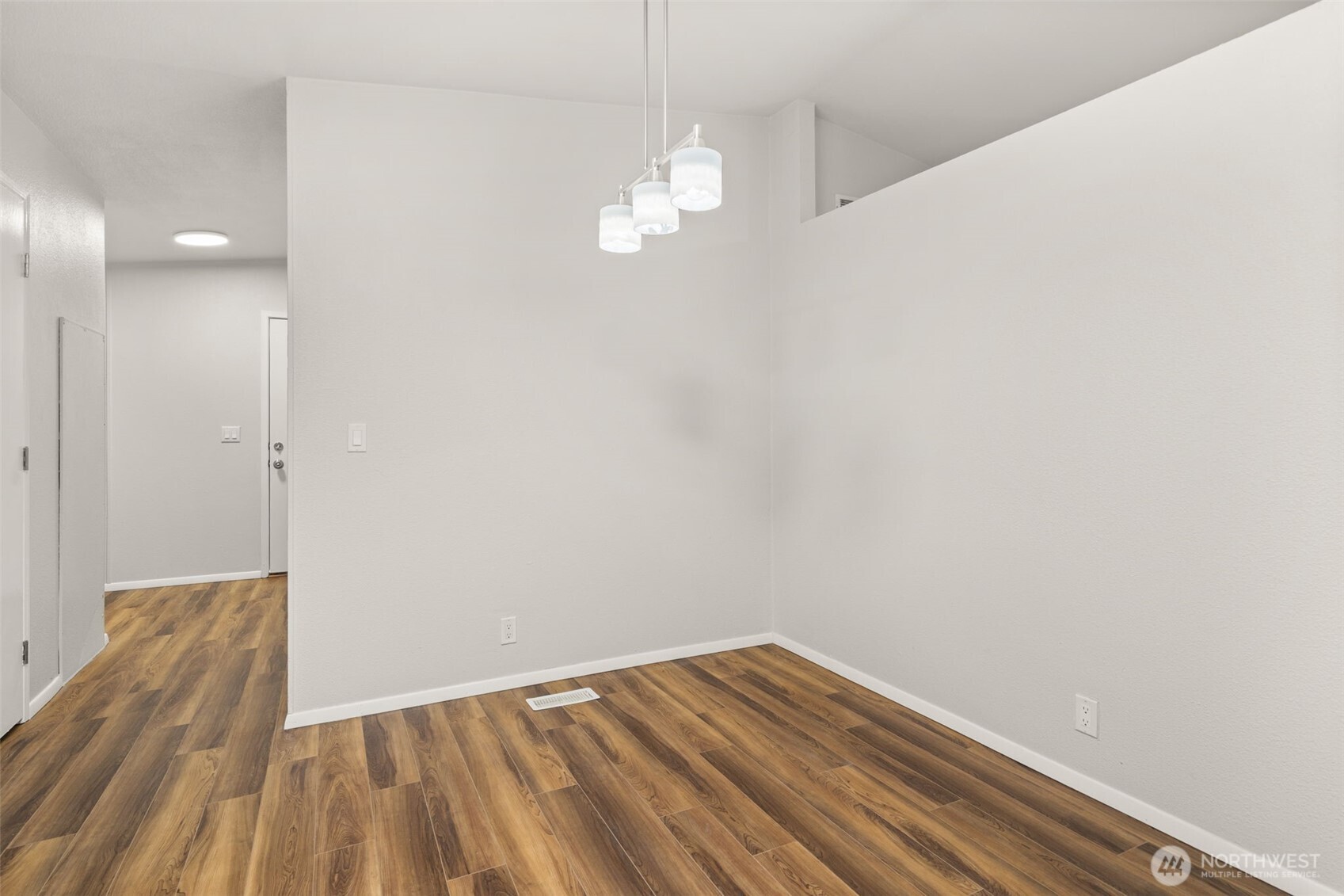 17340 Sargent Road Southwest, Unit 17 Rochester, WA 98579 - Photo 9 of 23 a view of a room with wooden floor and a ceiling fan