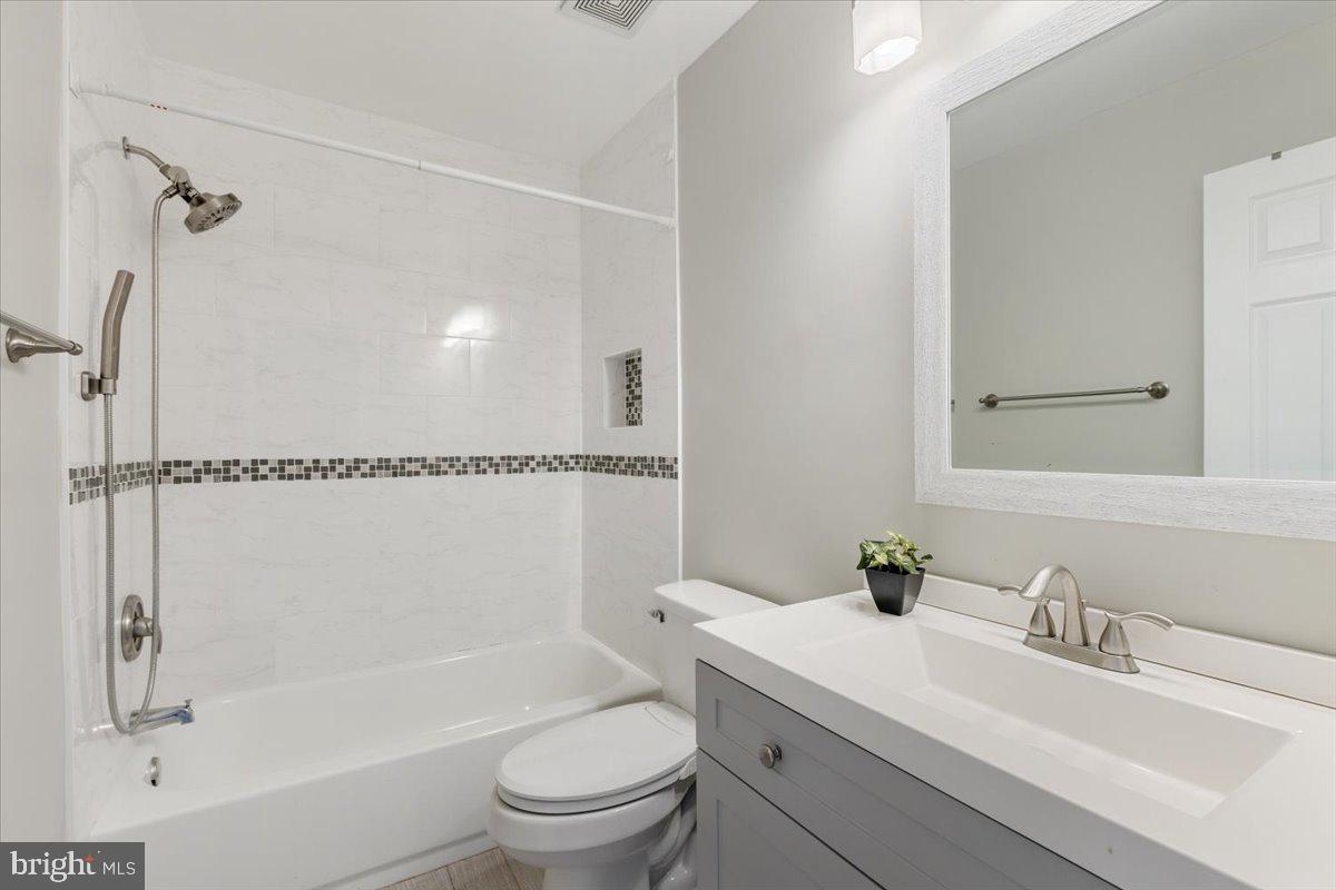 14159 Autumn Circle Centreville, VA 20121 - Photo 22 of 34 a bathroom with a sink toilet vanity and shower