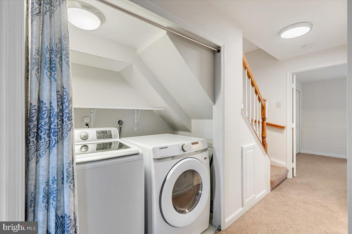 14159 Autumn Circle Centreville, VA 20121 - Photo 27 of 34 a view of washer and dryer with kitchen in the background
