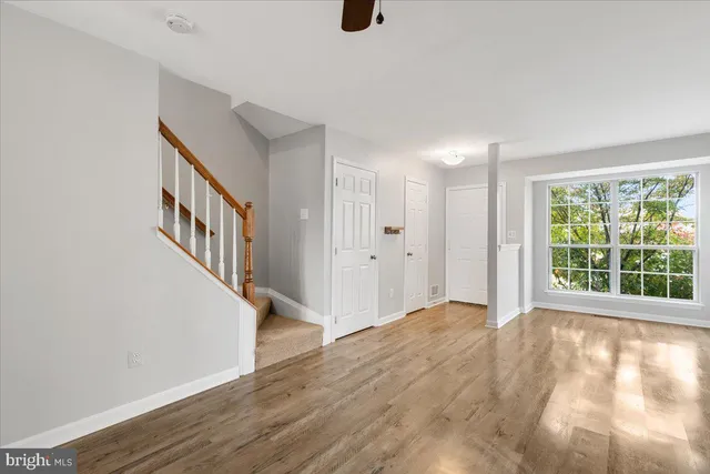 a view of an entryway with wooden floor