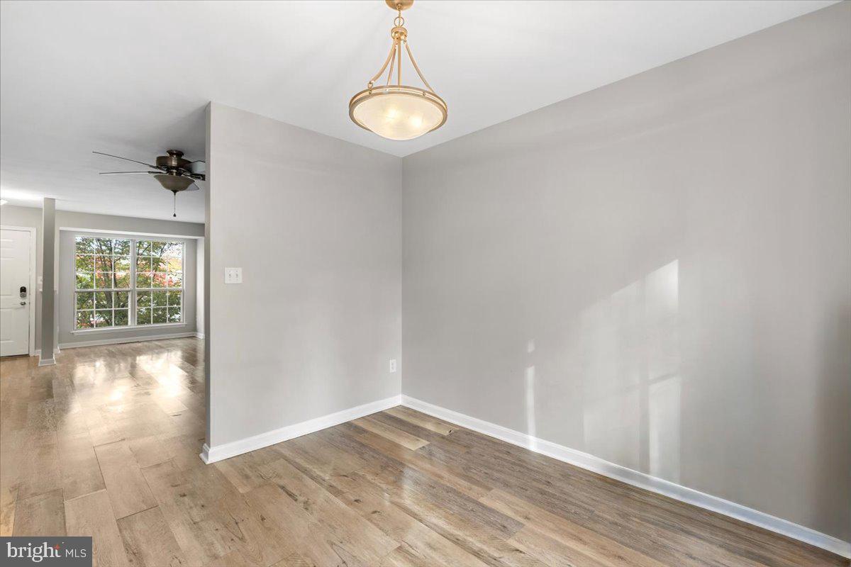 14159 Autumn Circle Centreville, VA 20121 - Photo 8 of 34 a view of empty room with wooden floor and fan