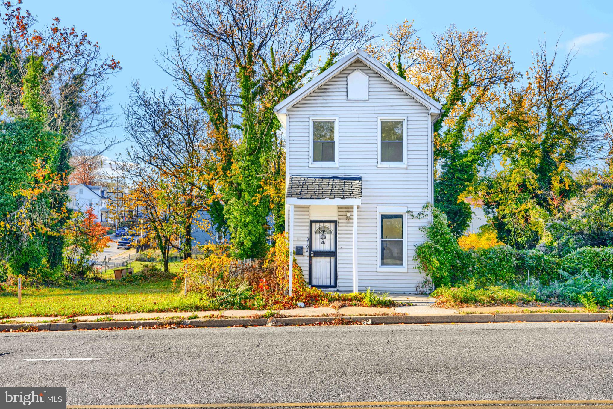 3106 Loch Raven Road Baltimore, MD 21218 - Photo 2 of 4 a front view of a house with a yard and garage
