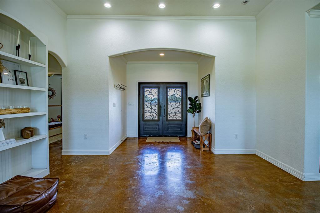 328 Meadow Lane Red Oak, TX 75154 - Photo 4 of 35 Foyer with arched walkways, french doors, concrete floors, crown molding, and recessed lighting
