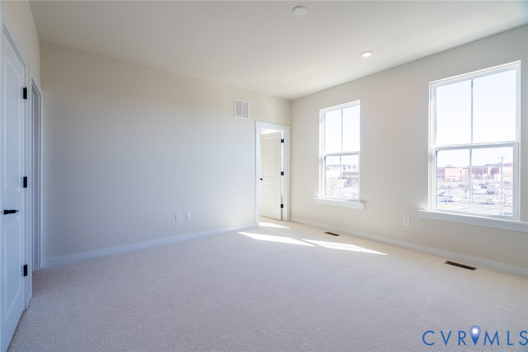 213 Golden Haze Alley, Unit 31 Midlothian, VA 23113 - Photo 5 of 15 a view of an empty room with a window