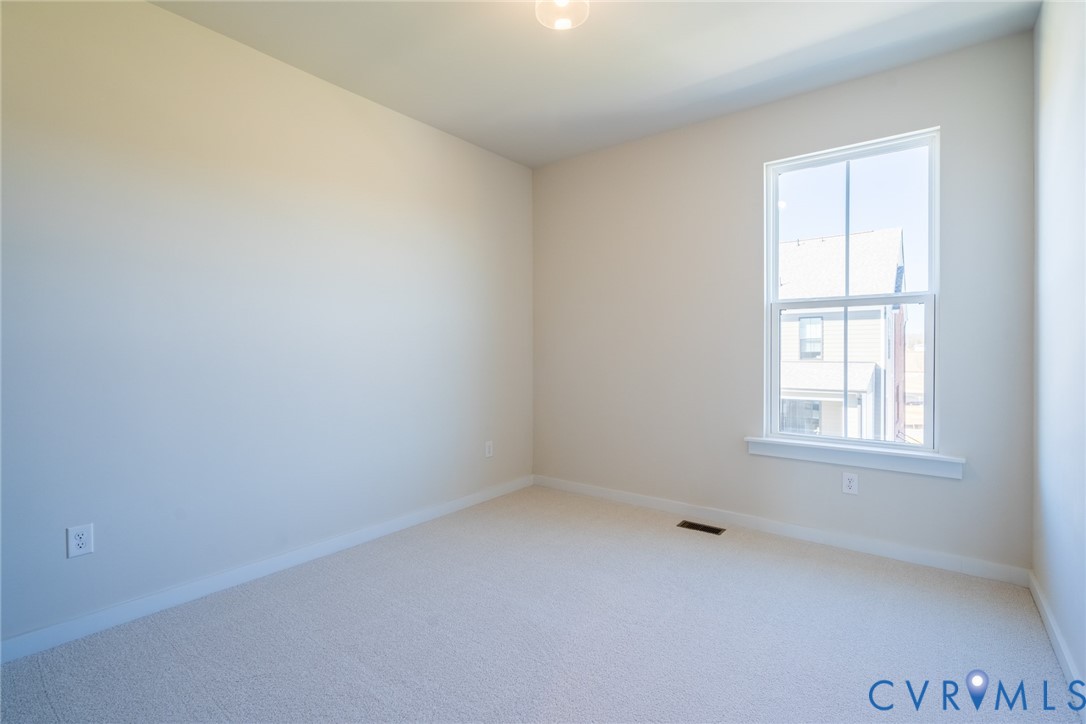 213 Golden Haze Alley, Unit 31 Midlothian, VA 23113 - Photo 9 of 15 an empty room with a window