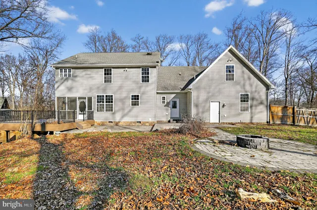 a view of a yard with large trees