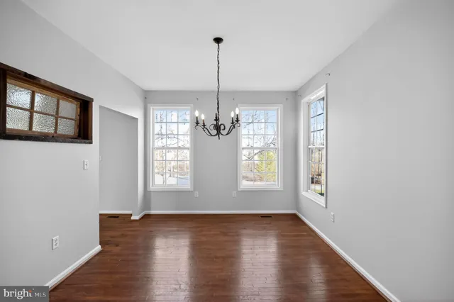 a kitchen with stainless steel appliances granite countertop a sink a counter space and cabinets