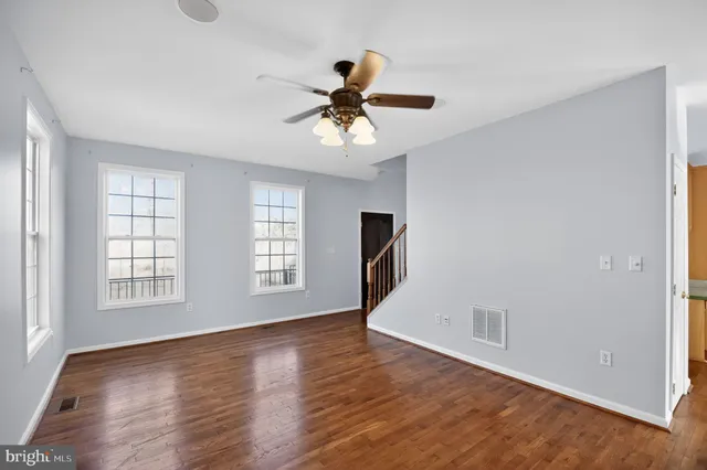 a large kitchen with stainless steel appliances granite countertop a stove sink and cabinets