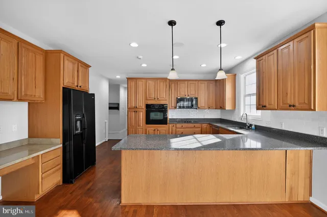 a view of entryway with wooden floor and stairs
