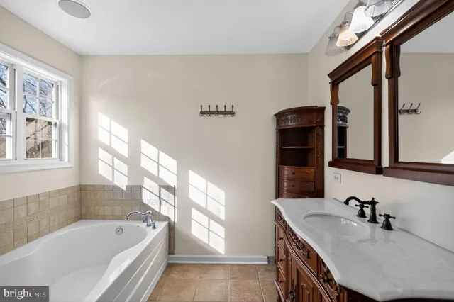 a view of an empty room with a ceiling fan