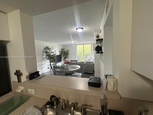520 Southeast 5th Avenue, Unit 2307 Fort Lauderdale, FL 33301 - Photo 11 of 21 a room with a couch and a potted plant