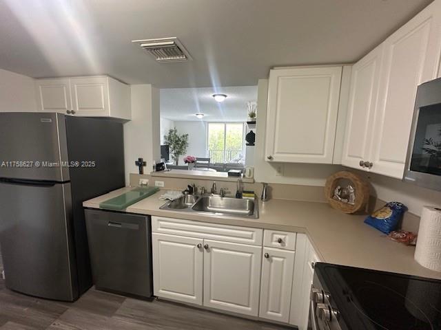 520 Southeast 5th Avenue, Unit 2307 Fort Lauderdale, FL 33301 - Photo 15 of 21 a kitchen with stainless steel appliances granite countertop a sink stove and refrigerator