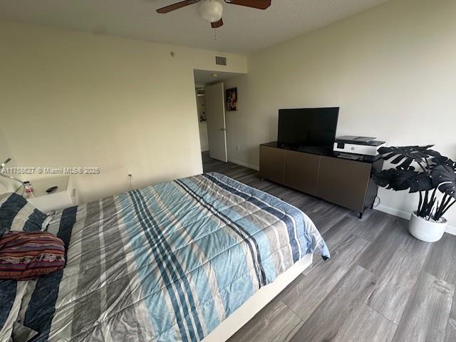 520 Southeast 5th Avenue, Unit 2307 Fort Lauderdale, FL 33301 - Photo 7 of 21 a bedroom with a bed and wooden floor