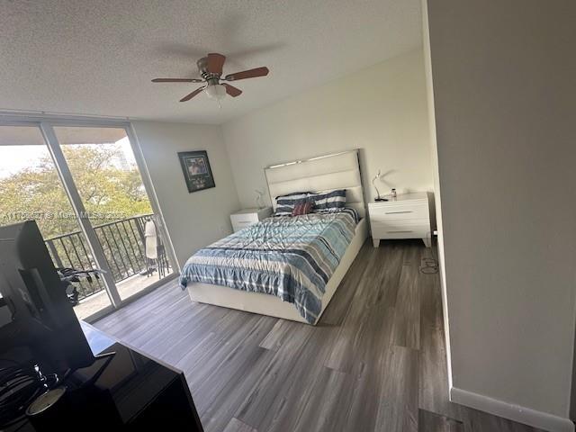520 Southeast 5th Avenue, Unit 2307 Fort Lauderdale, FL 33301 - Photo 8 of 21 a bedroom with a bed and wooden floor