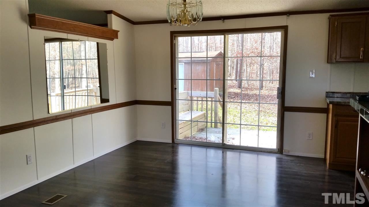 4815 Brown Road Rougemont, NC 27572 - Photo 23 of 23 a view of an empty room with wooden floor and a window