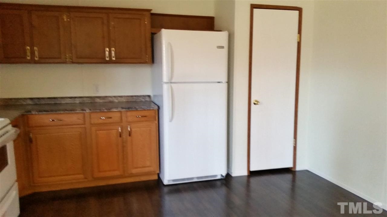 4815 Brown Road Rougemont, NC 27572 - Photo 6 of 23 a white refrigerator freezer sitting inside of a kitchen