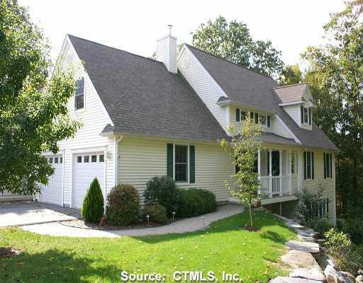 94 Rte 275-unit 9-stonehouse Road, Unit 9 Coventry, CT 06238 - Photo 1 of 1 a view of a house with a yard plants and a table and chairs