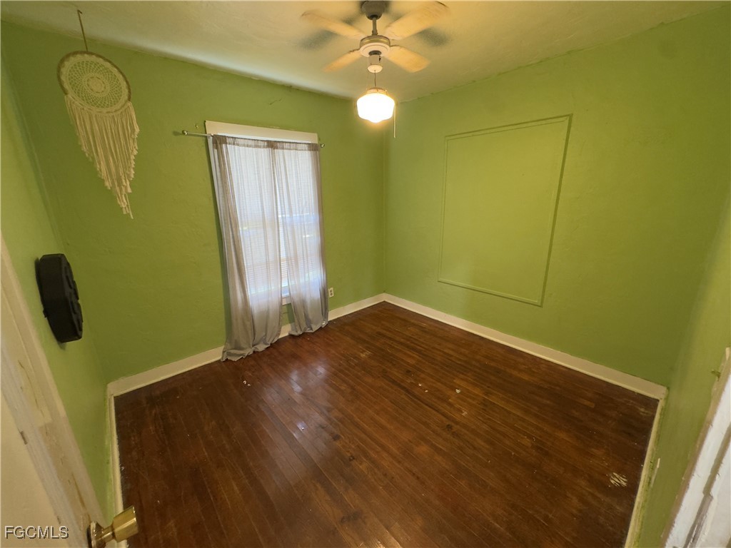 508 East Ventura Avenue Clewiston, FL 33440 - Photo 13 of 14 a view of a room with wooden floor and windows