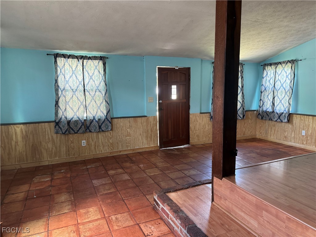508 East Ventura Avenue Clewiston, FL 33440 - Photo 3 of 14 a view of entryway with wooden floor