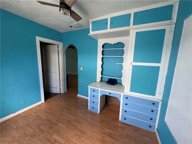 a view of an empty room with a dresser