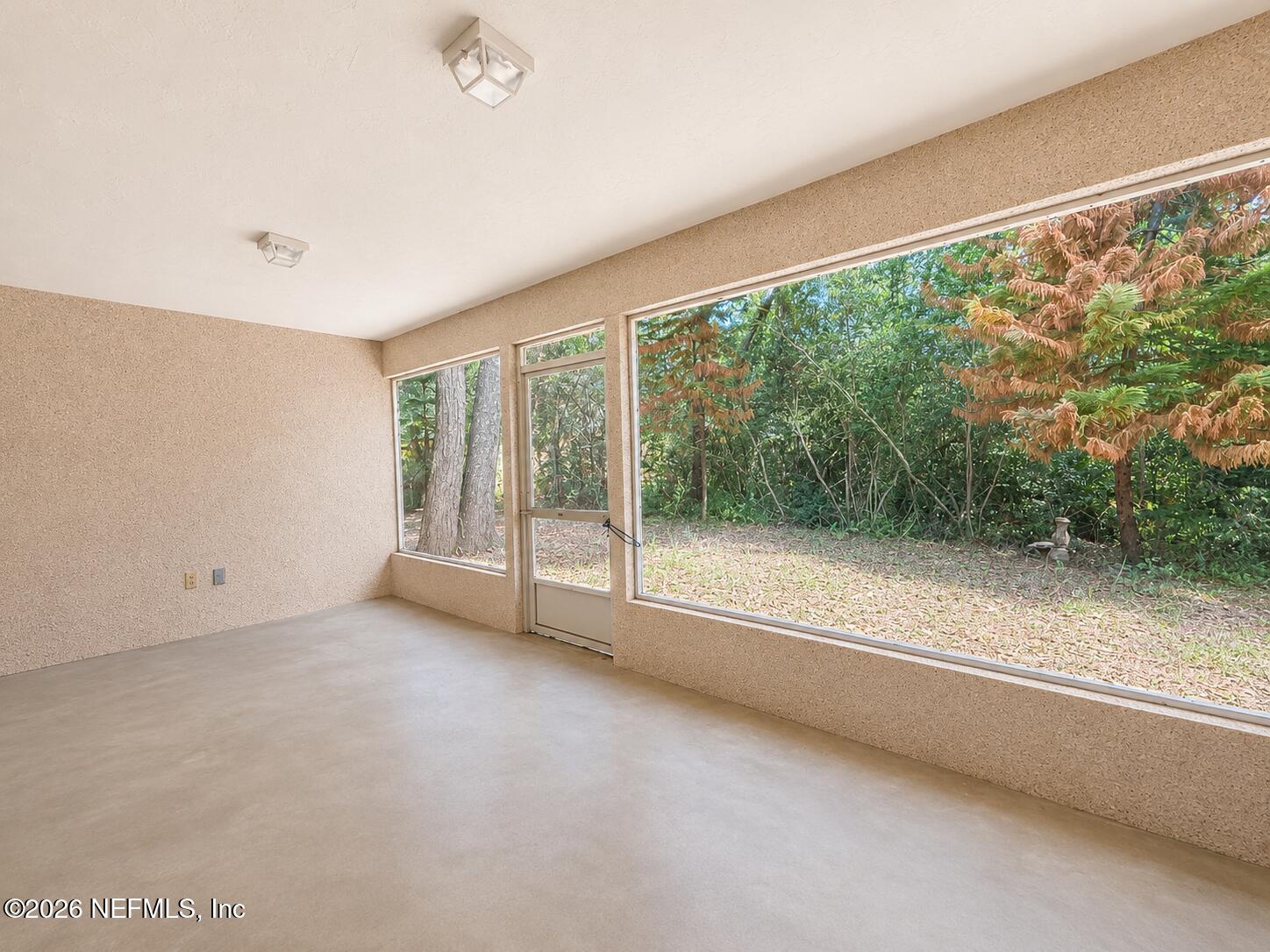 6 Surfcrest Street St. Augustine Beach, FL 32080 - Photo 15 of 15 an empty room with large windows
