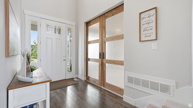 111 East Silver Oak Road Vineyard, UT 84059 - Photo 9 of 50 Entryway featuring a white paneled front door with sidelights and an upper transom window