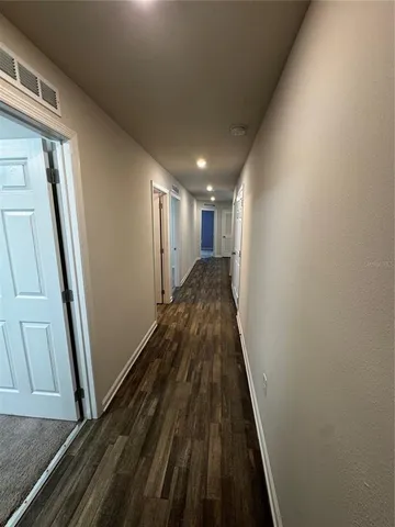 a view of entryway with wooden floor
