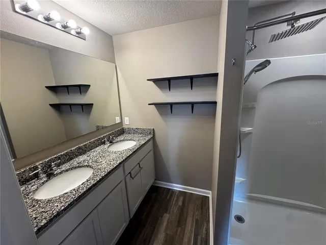 a kitchen with a sink and a refrigerator