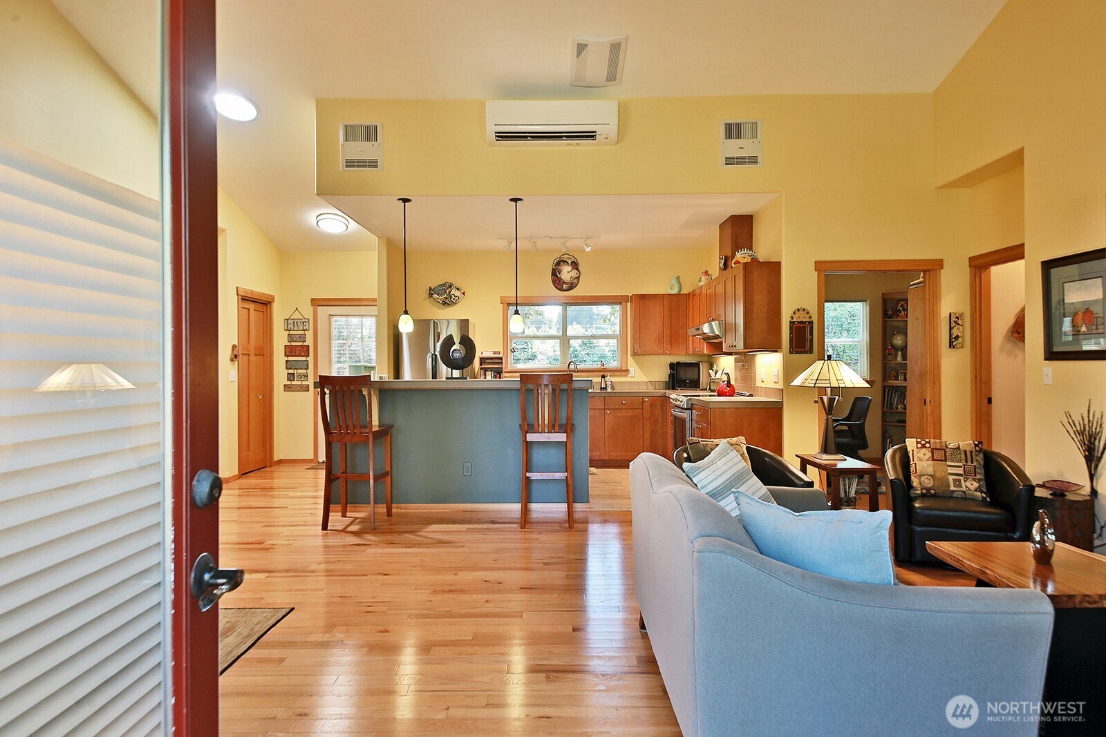 1050 Village Loop Langley, WA 98260 - Photo 18 of 39 a living room with couches a coffee table and next to a window with outer view
